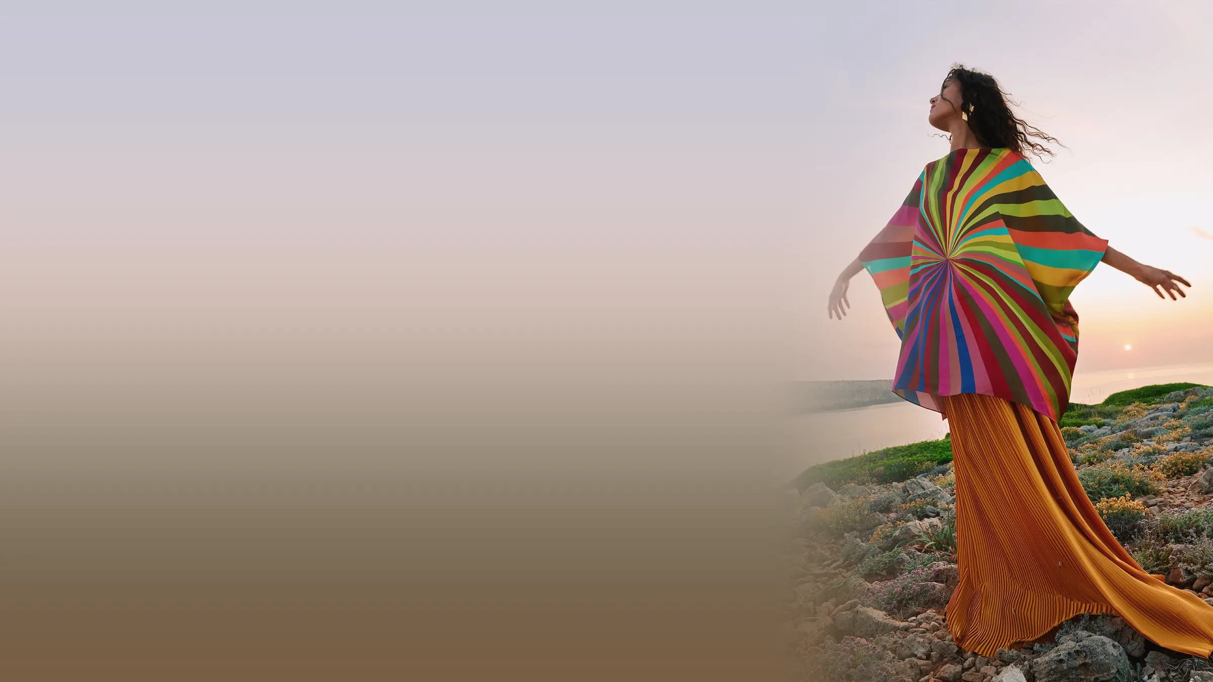 Campaign shot of a striped kaftan on a model at sunset